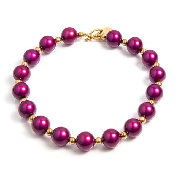 Goud en paars: een prachtig luxe combinatie. De paarse 'Kir Royaal" kralen hebben een 3d effect, wat deze unieke ketting nog bijzonderder maakt. Verwen jezelf met dit mooie cadeau.