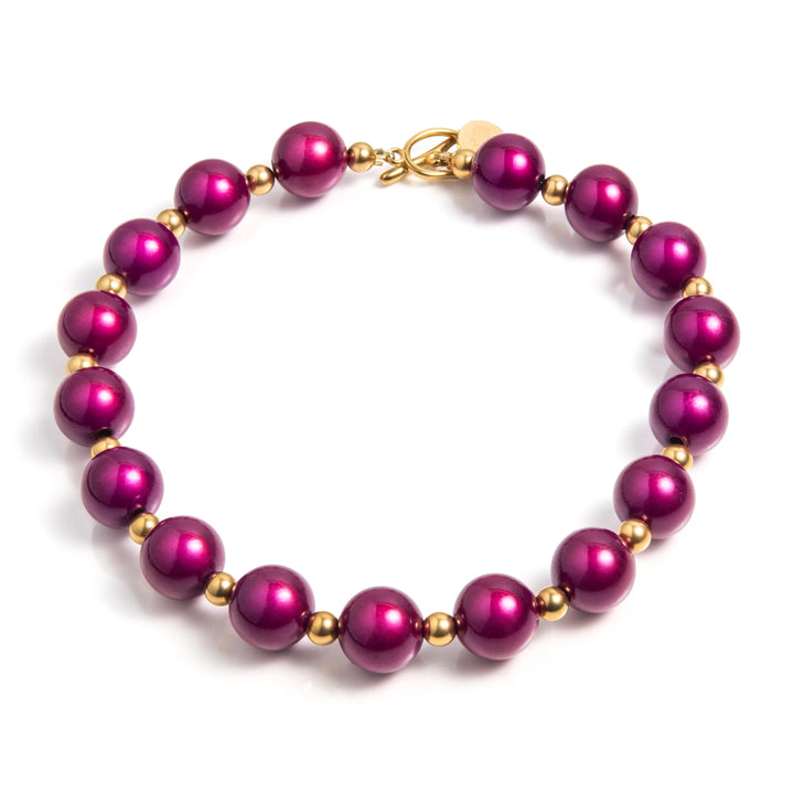 Goud en paars: een prachtig luxe combinatie. De paarse 'Kir Royaal" kralen hebben een 3d effect, wat deze unieke ketting nog bijzonderder maakt. Verwen jezelf met dit mooie cadeau.