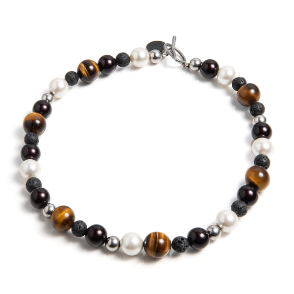 Ketting, inclusief, statement piece, zwart, bruin en witte accenten. Diverse natuurlijke materialen. Unieke combincatie van kralen. Ontworpen en gemaakt in Nederland.