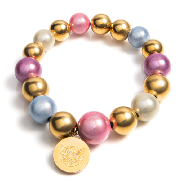 Diverse kleuren pastel tinten in combinatie met (premium chirirgisch staal) goud maken deze armband tijdloos en chique. Gemakkelijk te comineren met vele outfit en look, voor een luxe stijl. Prachtig te combineren in een set met andere Lemon Luxury armbanden of ketting. Komt in een luxe cadeauverpakking.